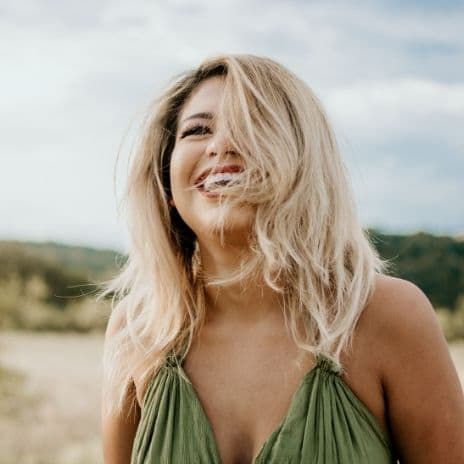 Blond hair woman in green dress