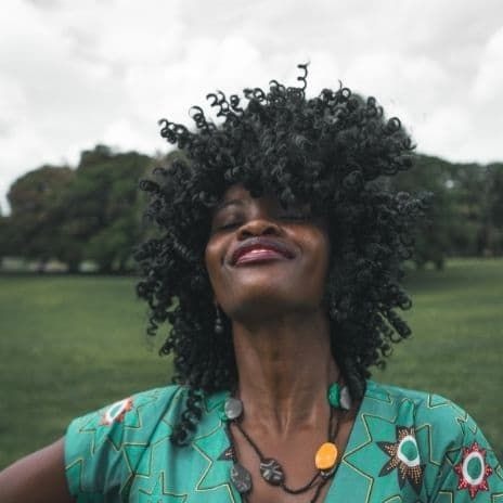 woman smiling with curly hair